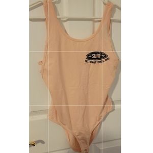 Light pink body suit